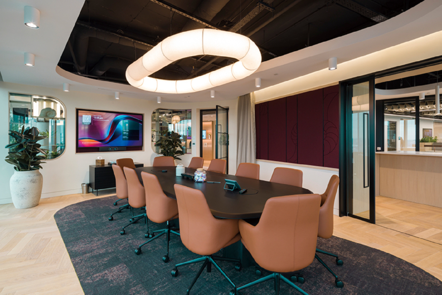 s8_17 - Curved-edge ceiling cut-out reflected in identical shape to rug beneath board table.jpg