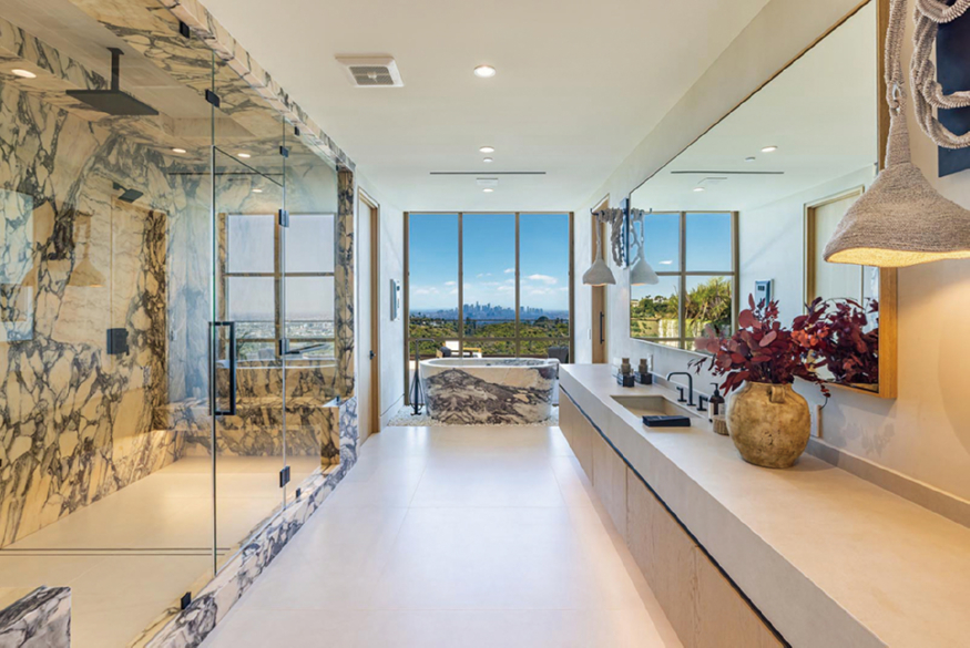 26-1414-Donhill-Drive-luxury-Beverly-Hills-mansion-modern-primary-bedroom-with-marble-shower-&-tub-&-view.jpg